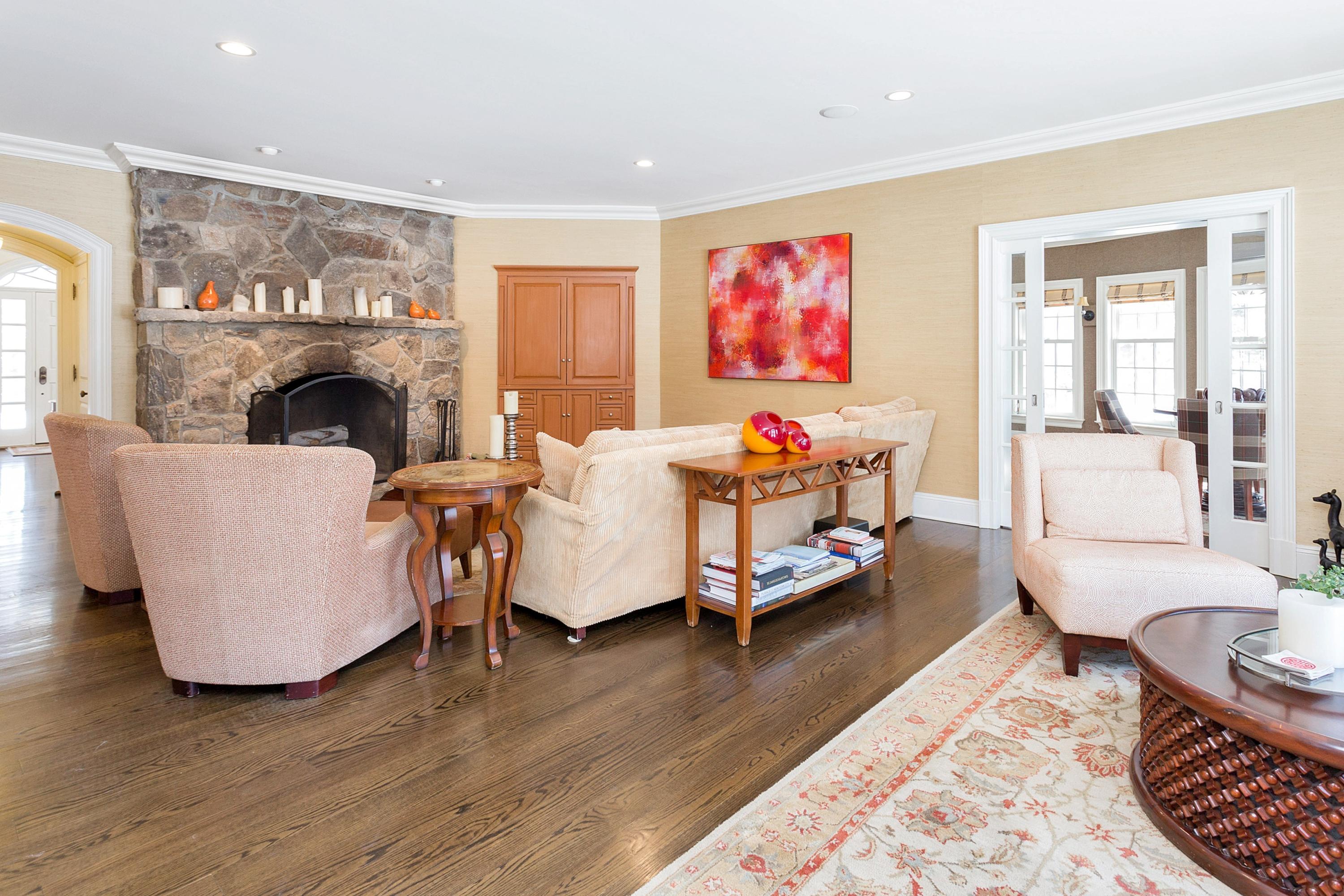 741 Hollow Tree Ridge Road Darien, CT 06820 - Photo 15 of 60 a living room with furniture and a fireplace
