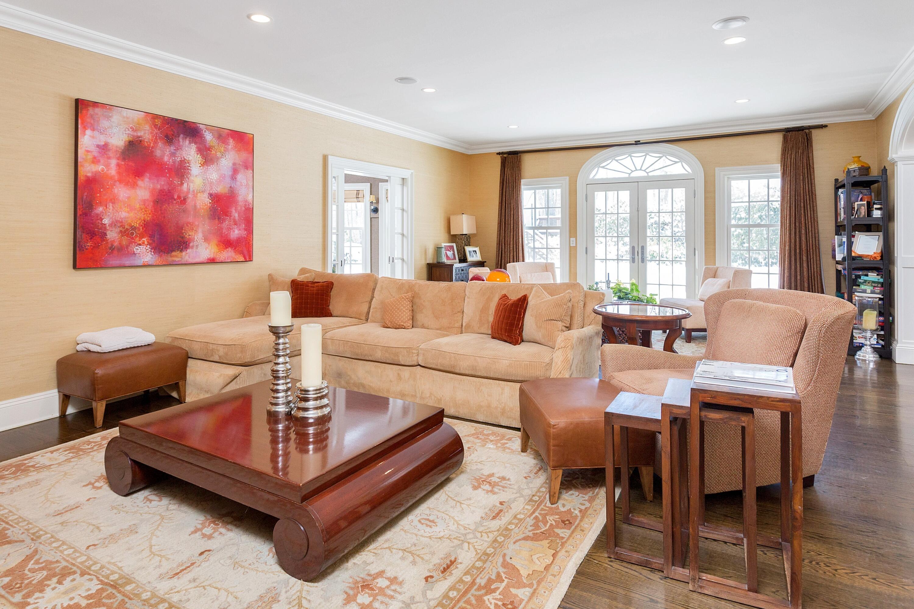 741 Hollow Tree Ridge Road Darien, CT 06820 - Photo 18 of 60 a living room with furniture a rug and a large window