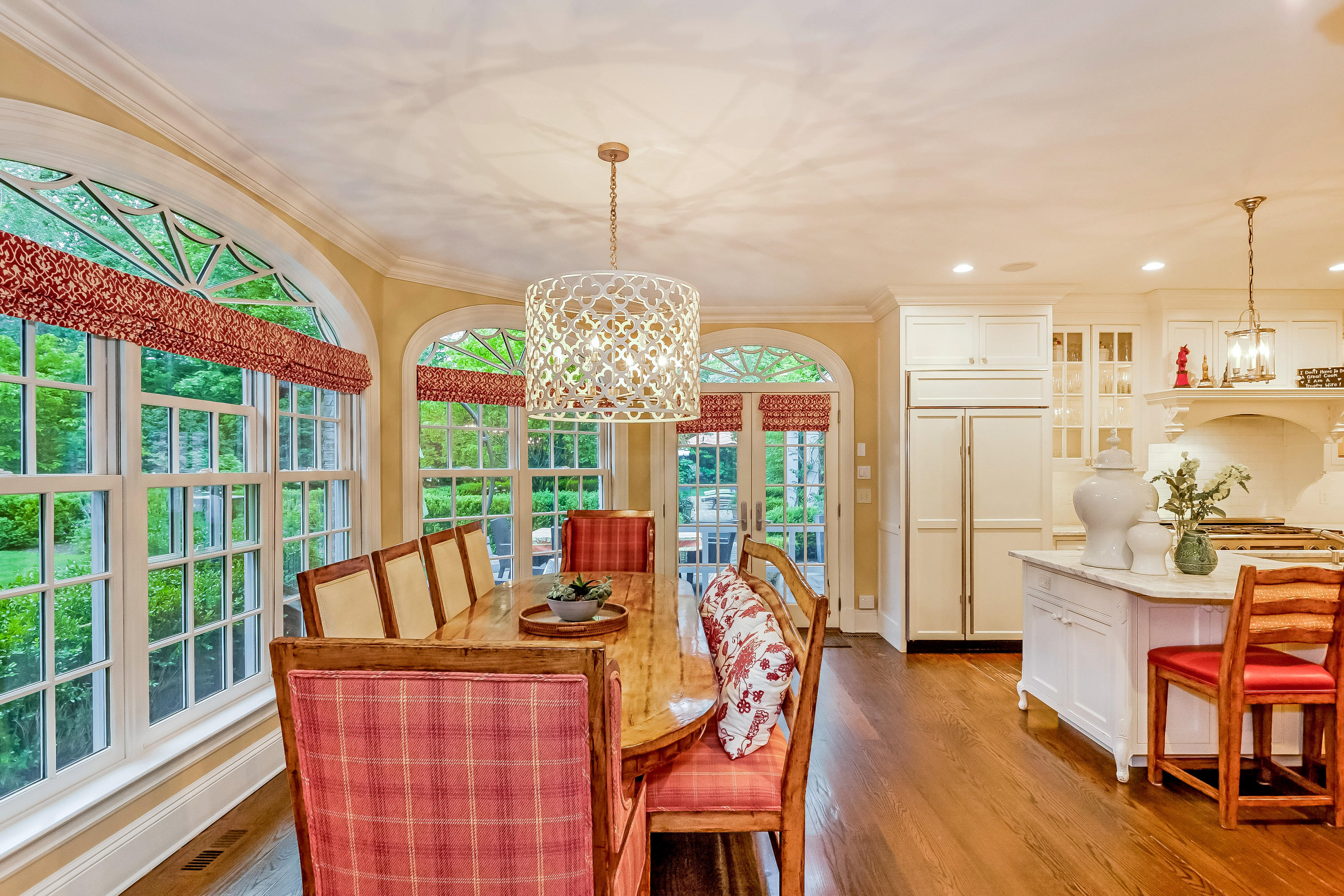741 Hollow Tree Ridge Road Darien, CT 06820 - Photo 19 of 60 a view of a dining room with furniture a chandelier and wooden floor
