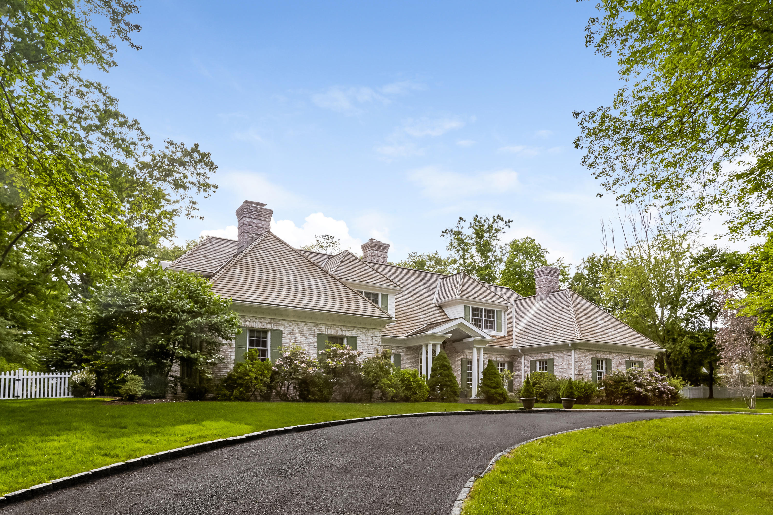 741 Hollow Tree Ridge Road Darien, CT 06820 - Photo 3 of 60 a front view of a house with a yard