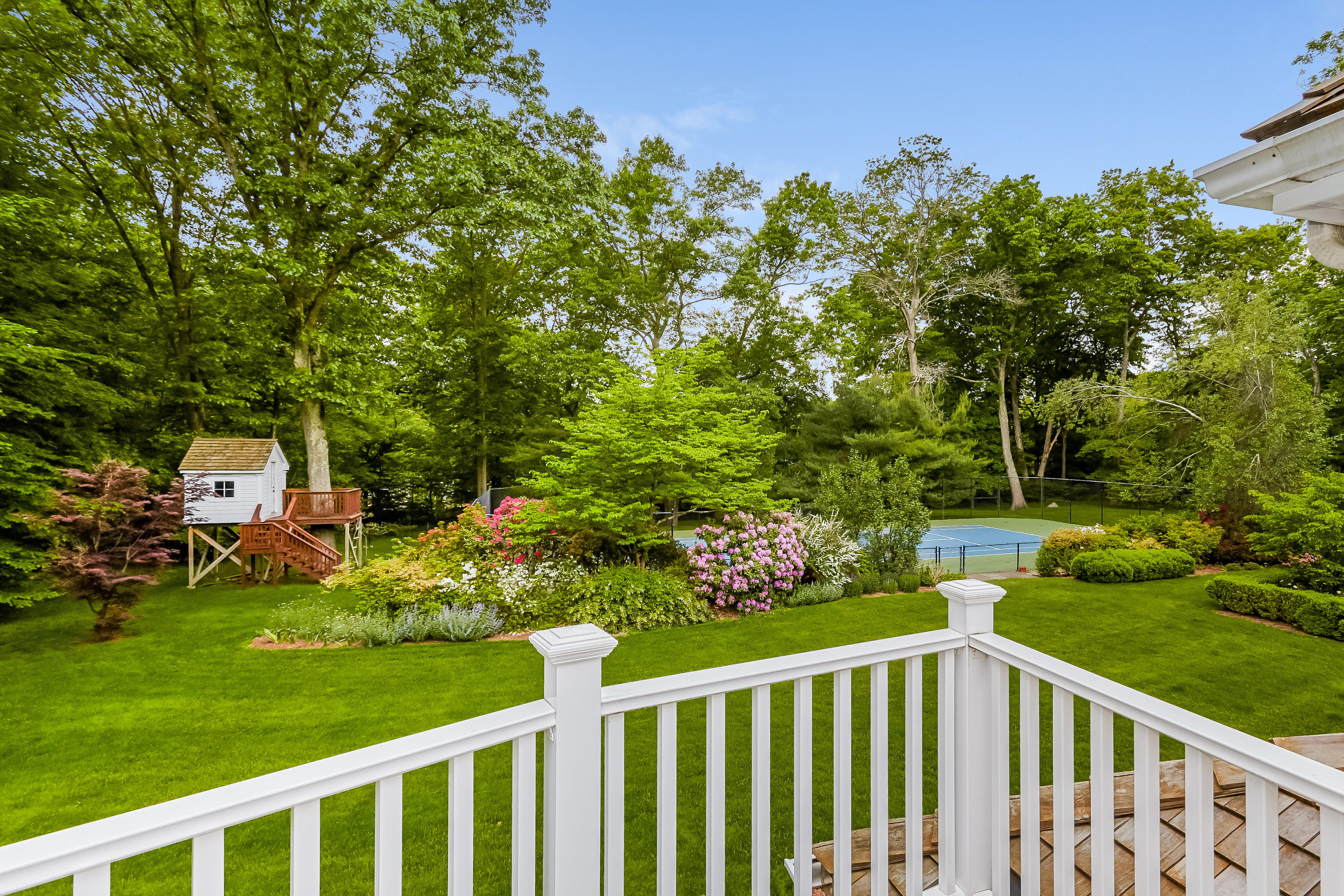 741 Hollow Tree Ridge Road Darien, CT 06820 - Photo 34 of 60 a view of a yard and deck