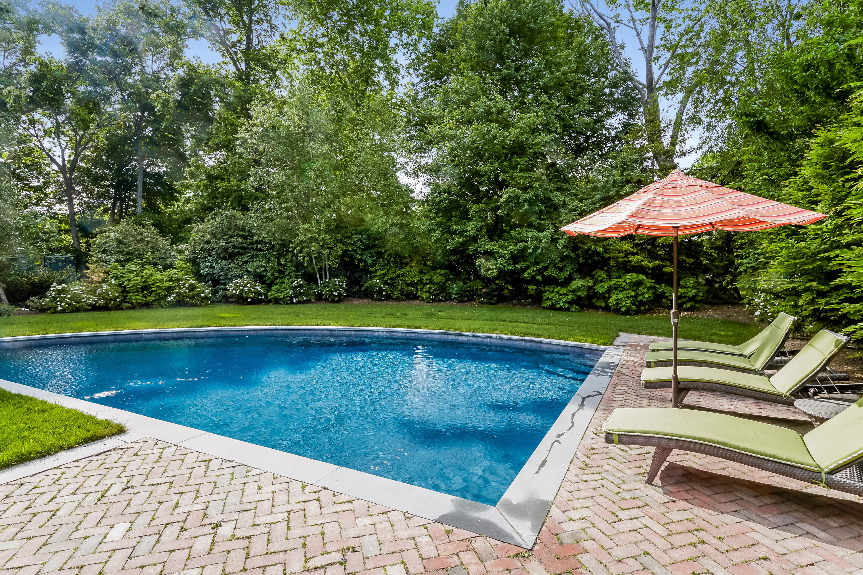 741 Hollow Tree Ridge Road Darien, CT 06820 - Photo 47 of 60 a view of a swimming pool with lounge chair