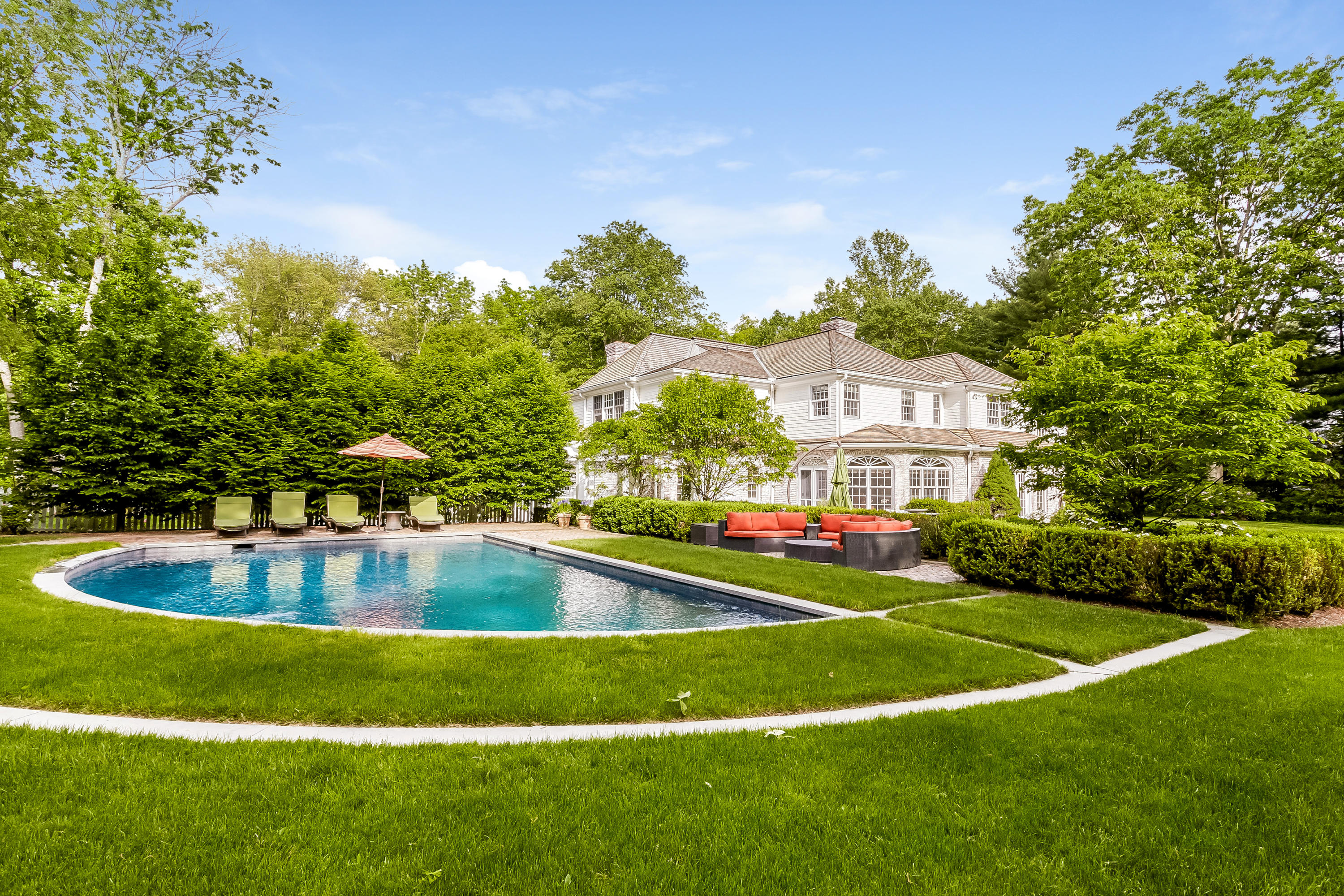 741 Hollow Tree Ridge Road Darien, CT 06820 - Photo 48 of 60 a view of a swimming pool is middle in the grass