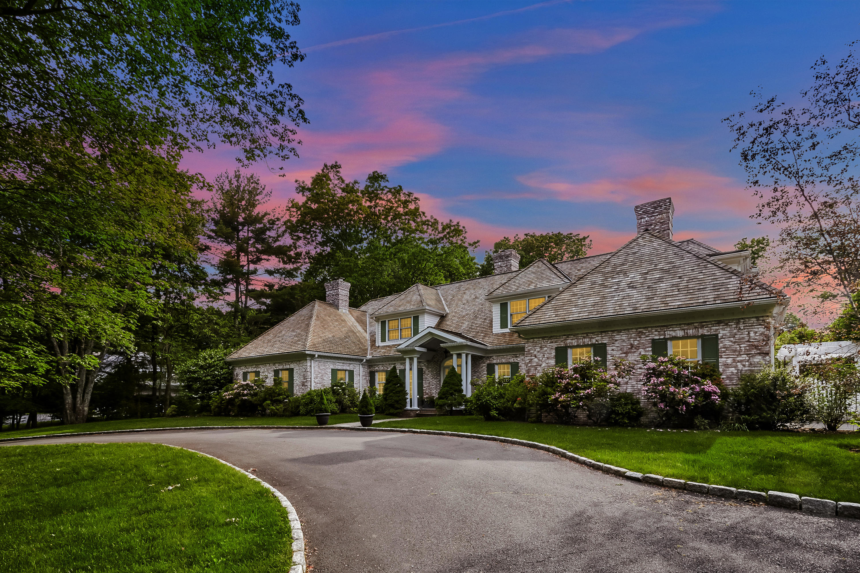 741 Hollow Tree Ridge Road Darien, CT 06820 - Photo 57 of 60 a front view of a house with a yard