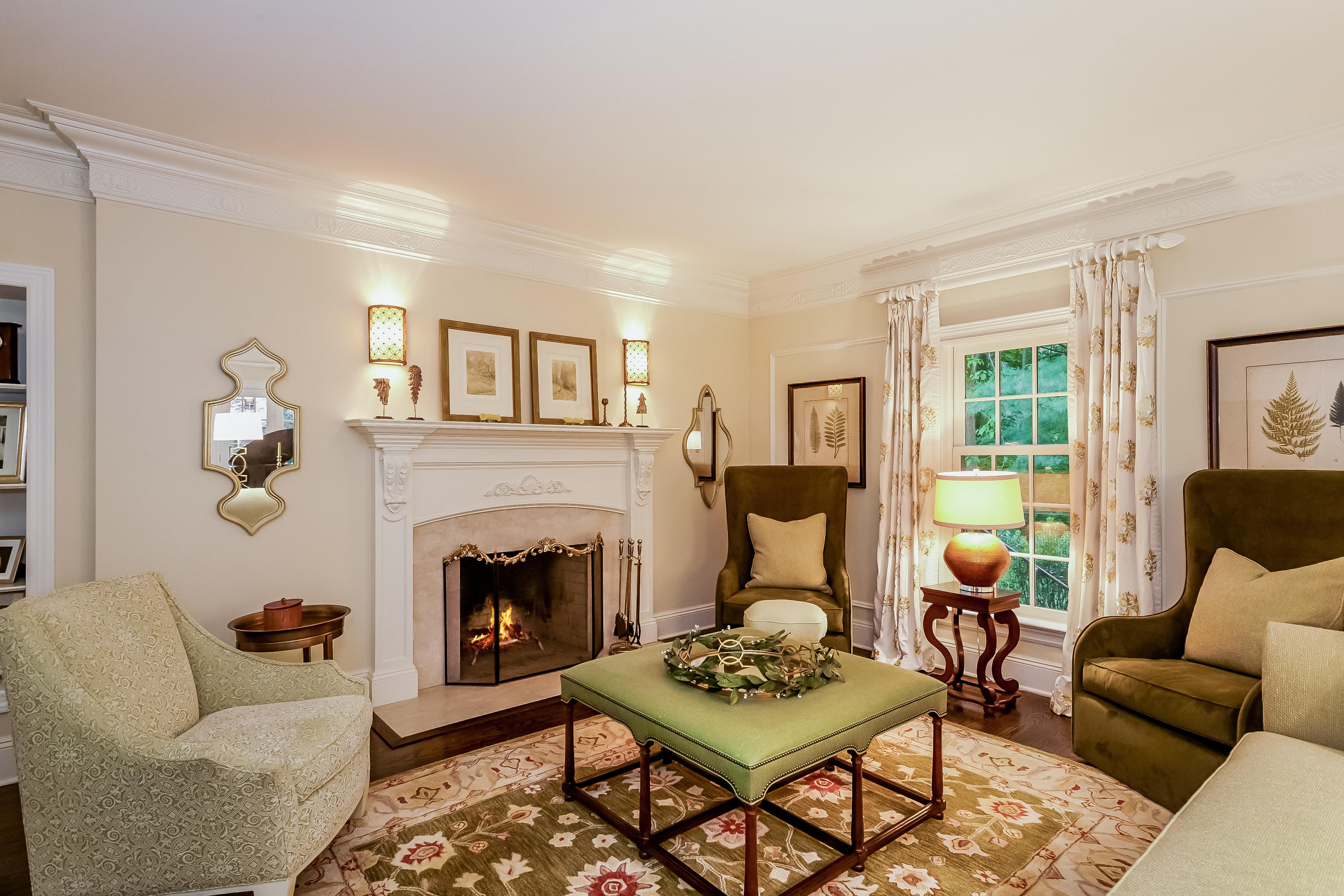 741 Hollow Tree Ridge Road Darien, CT 06820 - Photo 7 of 60 a living room with furniture a fireplace and a table