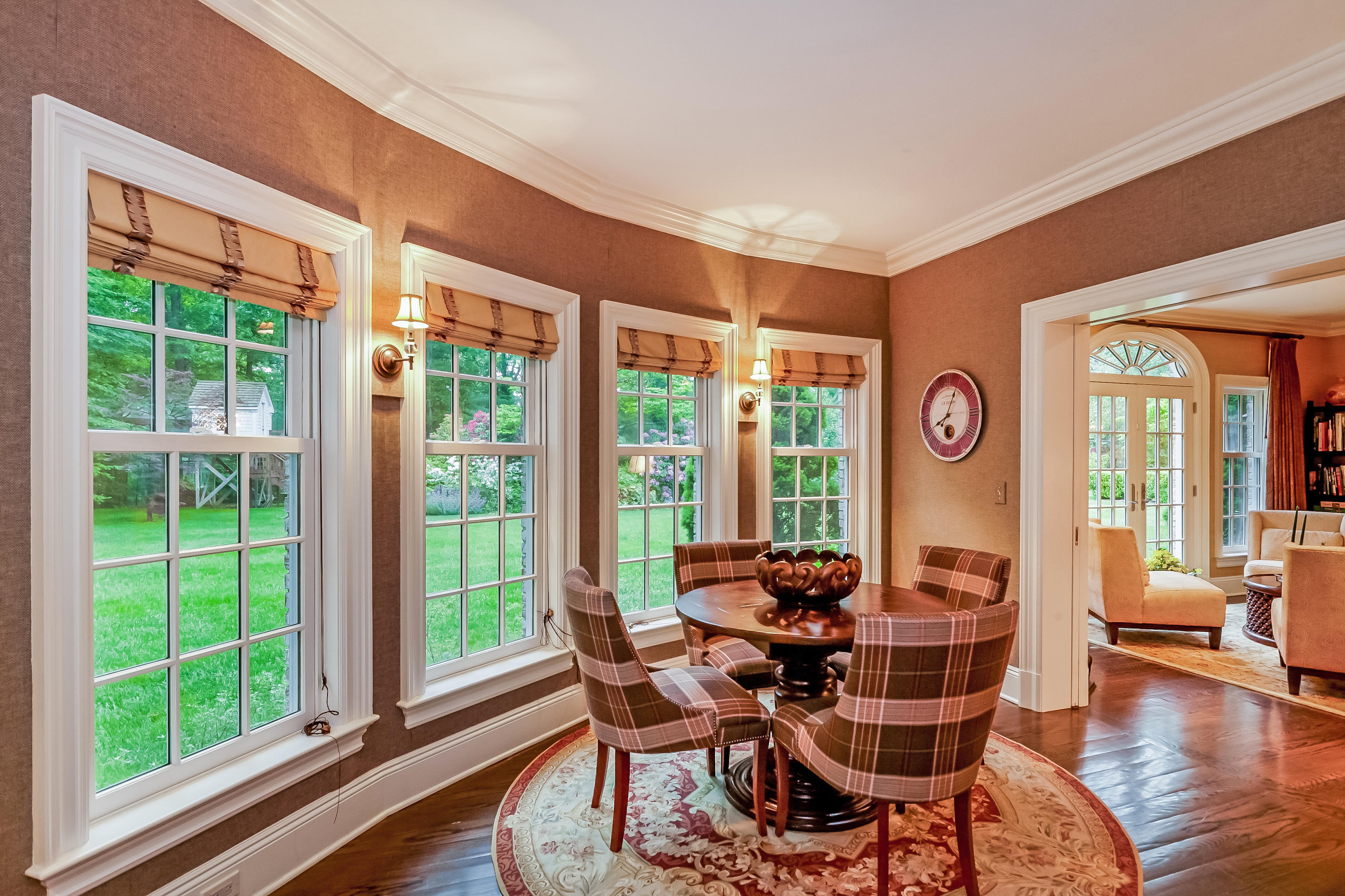 741 Hollow Tree Ridge Road Darien, CT 06820 - Photo 10 of 60 a dining room with furniture a chandelier and wooden floor