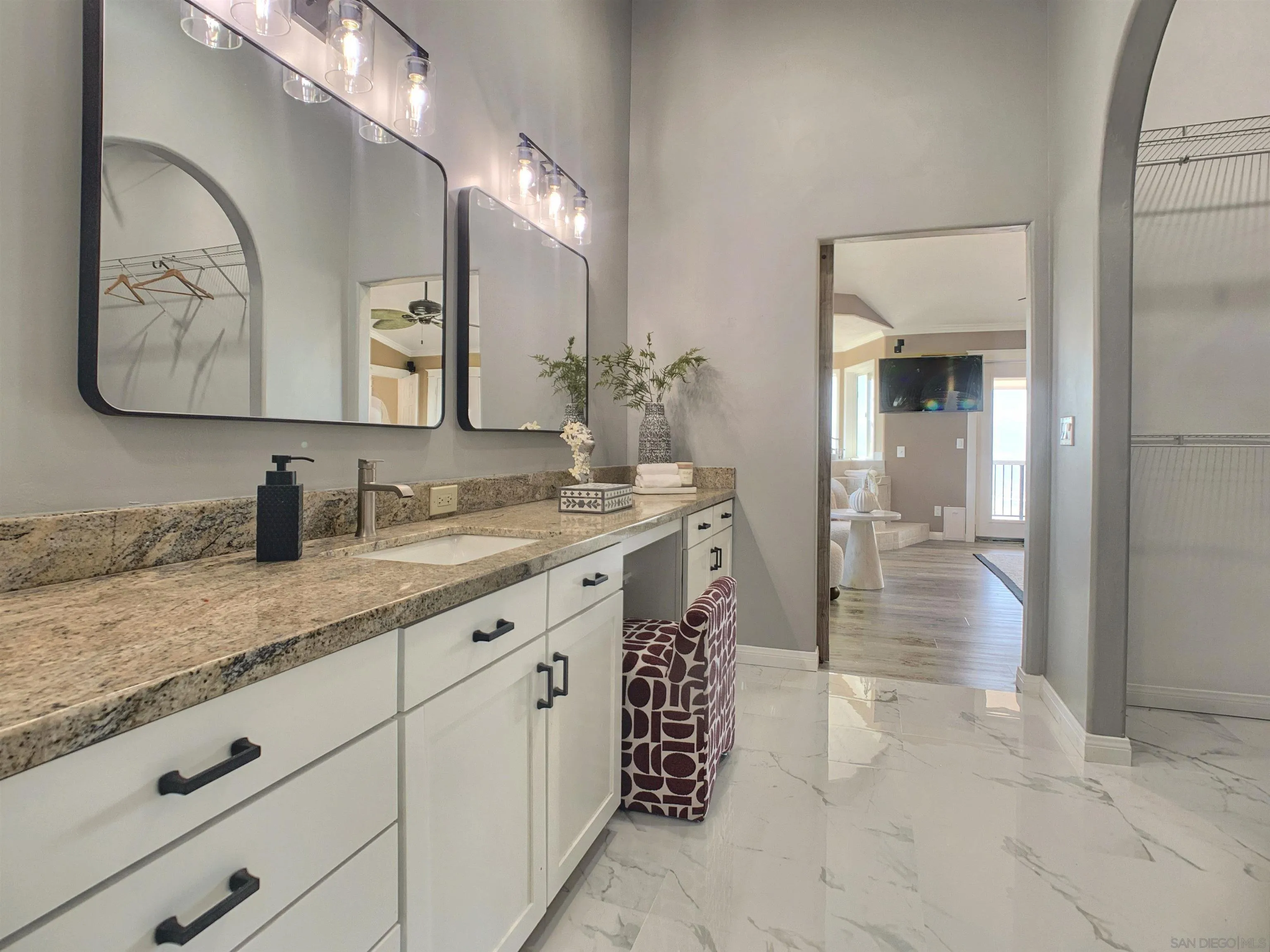 205 Highline Trail El Cajon, CA 92021 - Photo 23 of 45 a spacious bathroom with a granite countertop sink a mirror and a