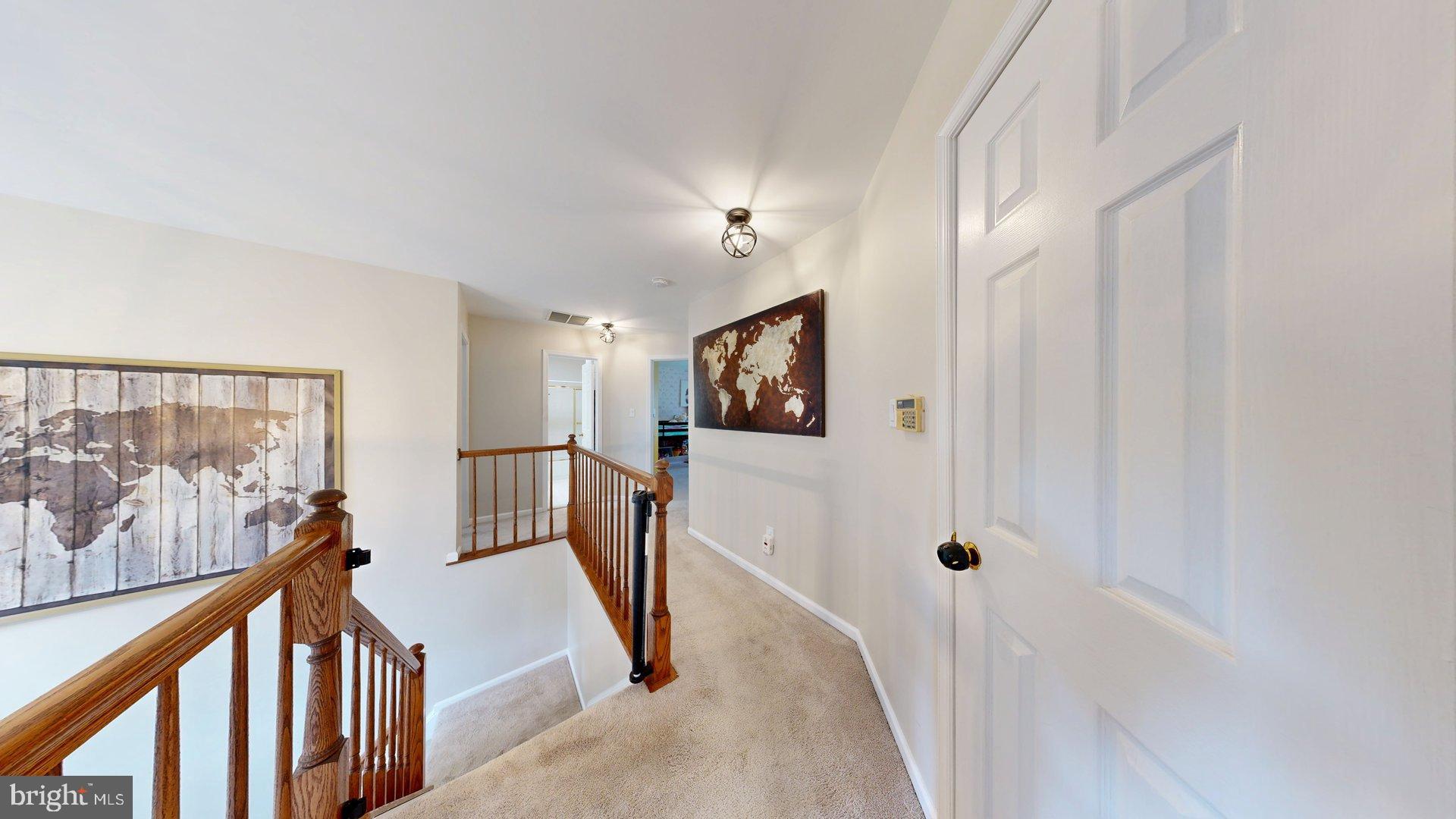 11901 Rustic Farm Court Germantown, MD 20874 - Photo 33 of 134 Inviting hallway with world map art.