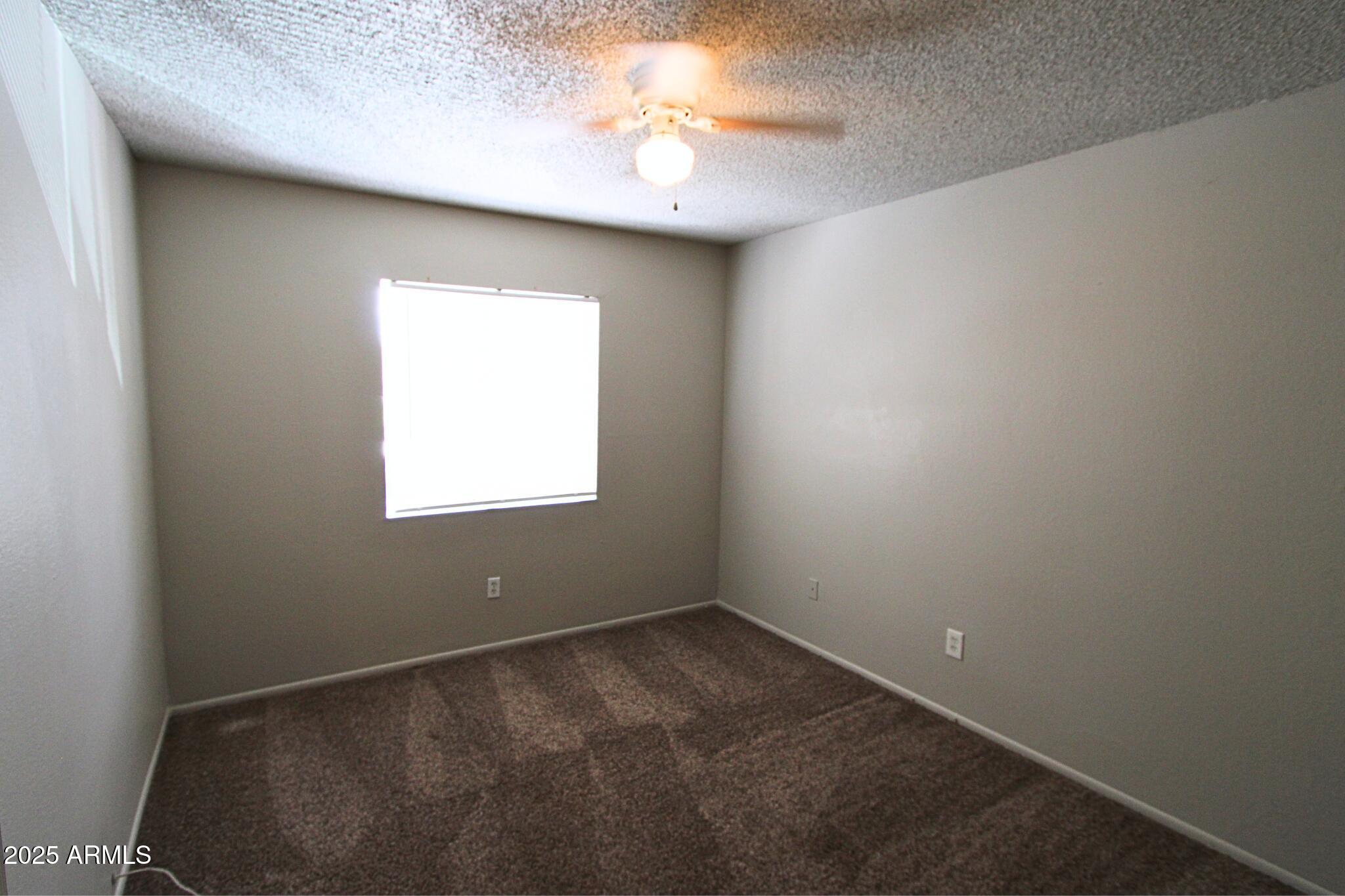 410 East 9th Avenue, Unit 1 Mesa, AZ 85204 - Photo 16 of 17 an empty room with a window