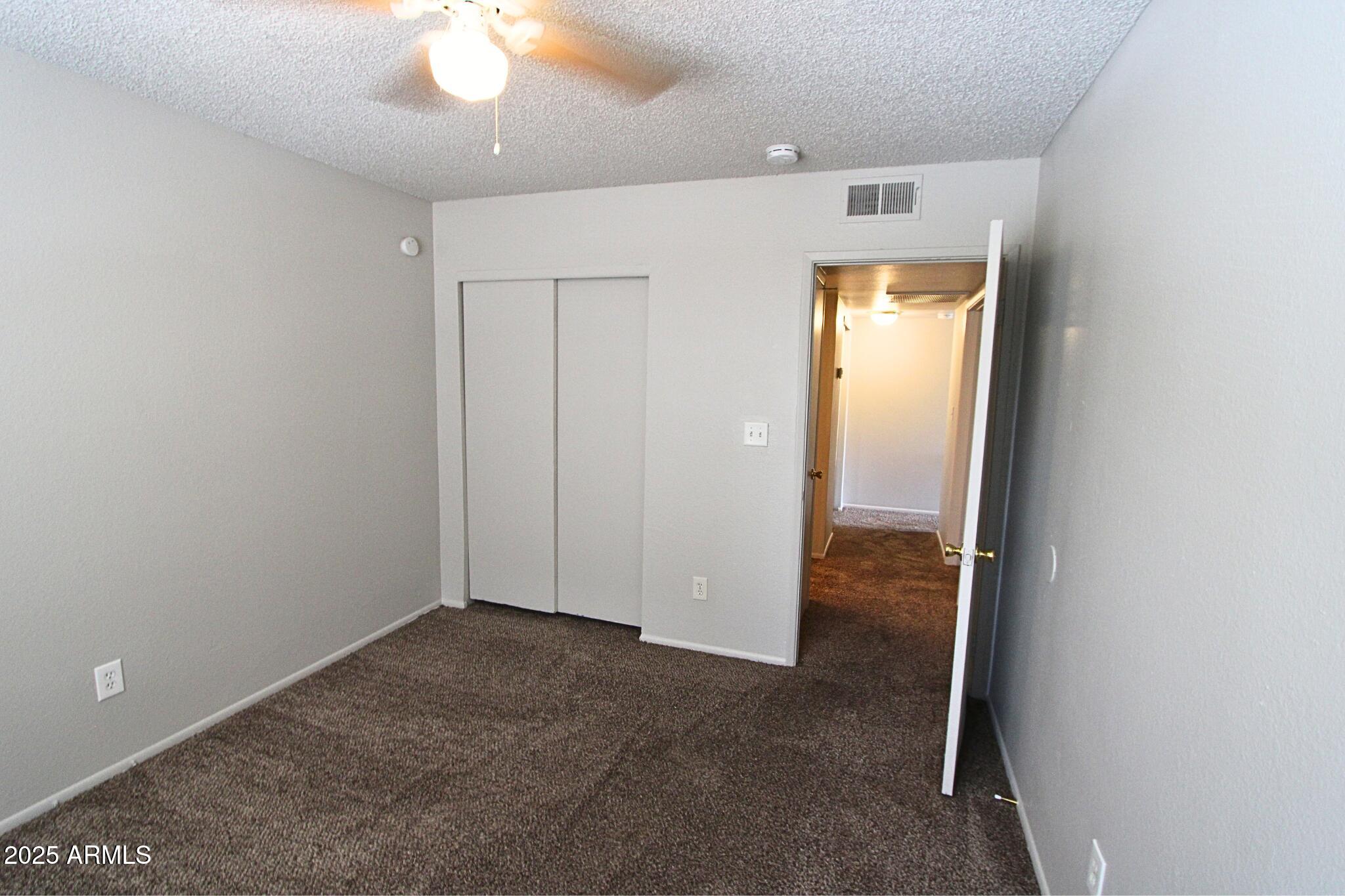 410 East 9th Avenue, Unit 1 Mesa, AZ 85204 - Photo 17 of 17 an empty room with a bathroom