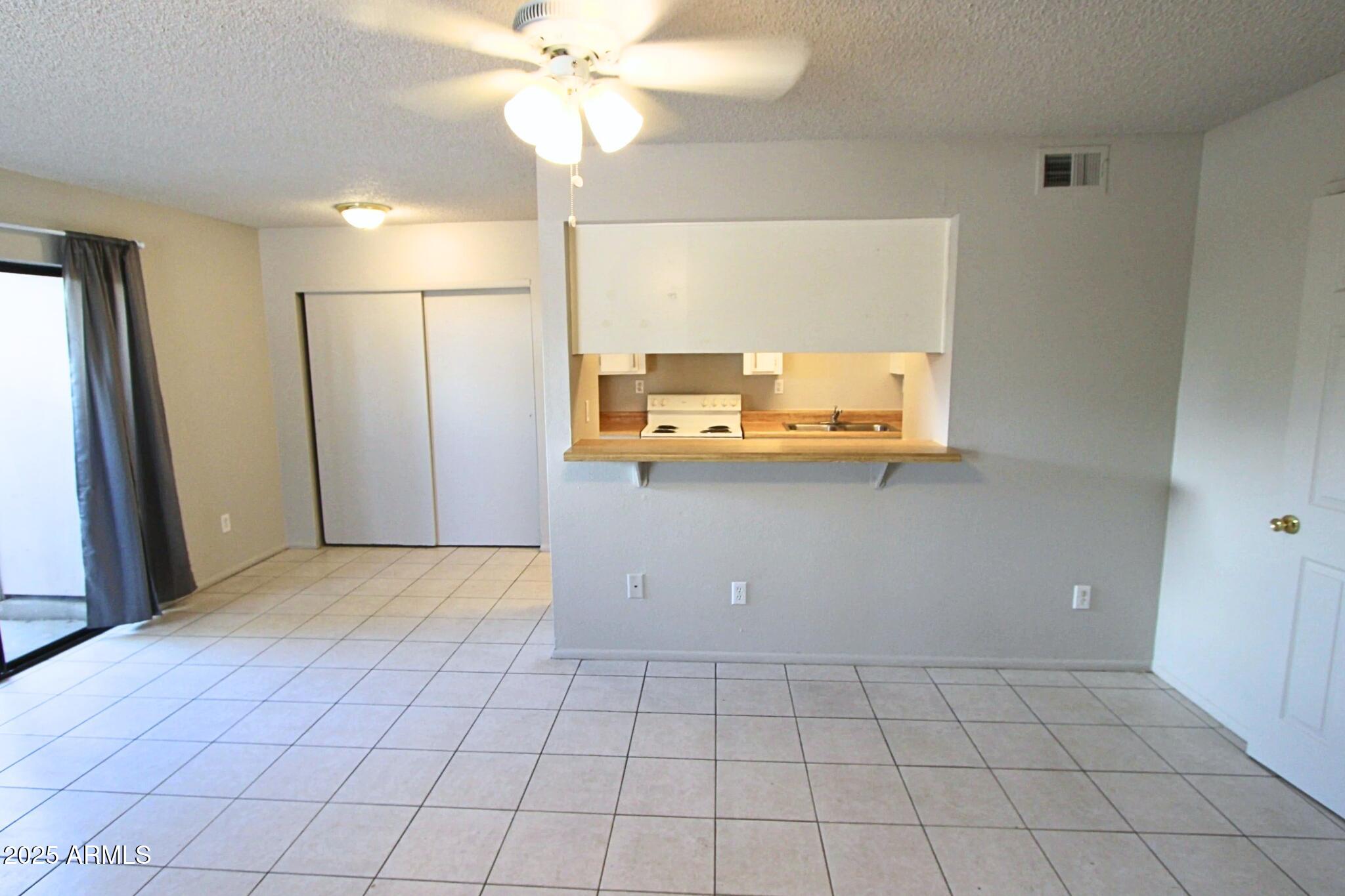 410 East 9th Avenue, Unit 1 Mesa, AZ 85204 - Photo 4 of 17 a view of a storage & utility room with a window