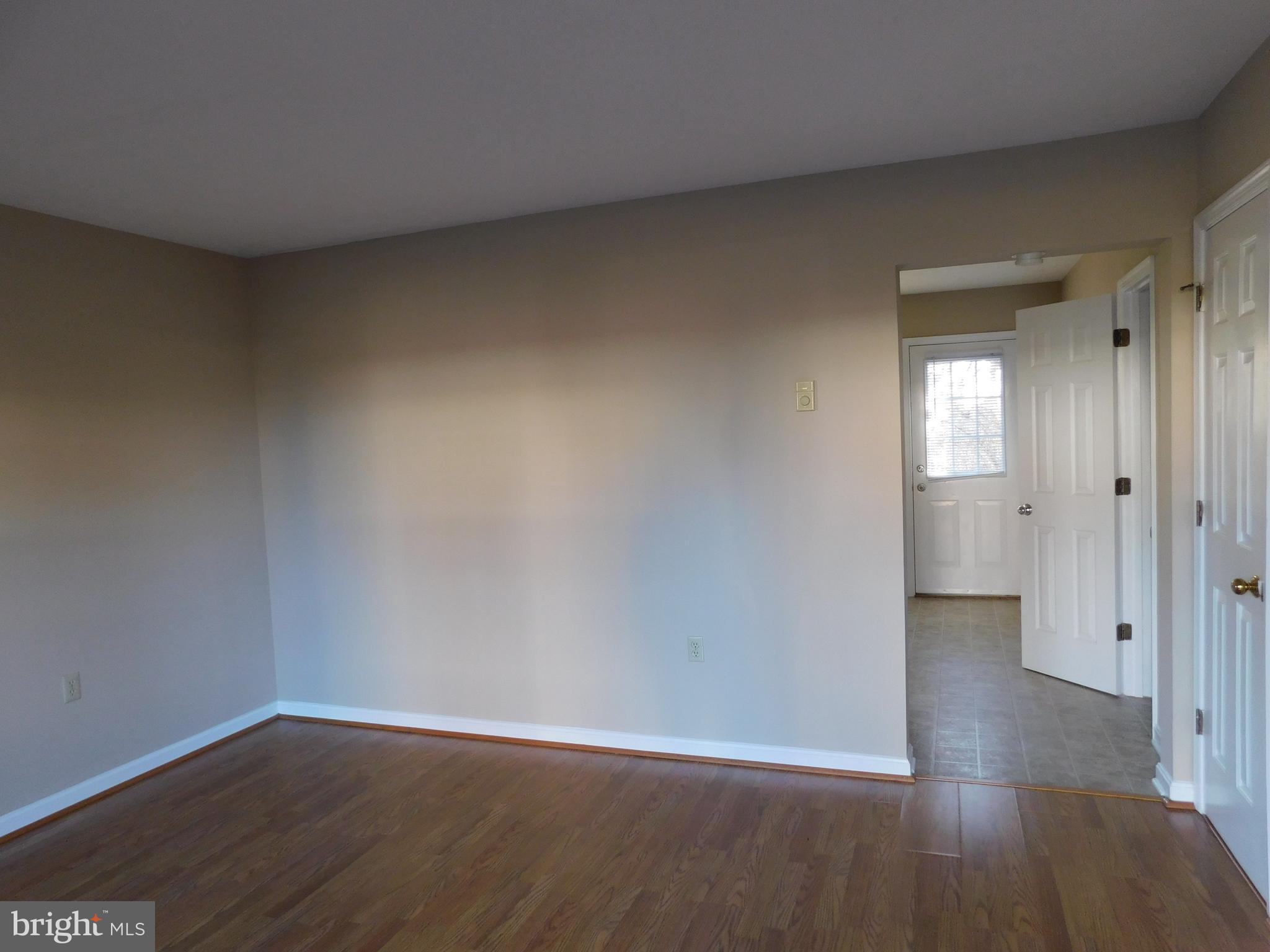 2918 Packer Street Winchester, VA 22601 - Photo 2 of 12 a view of wooden floor and windows in a room