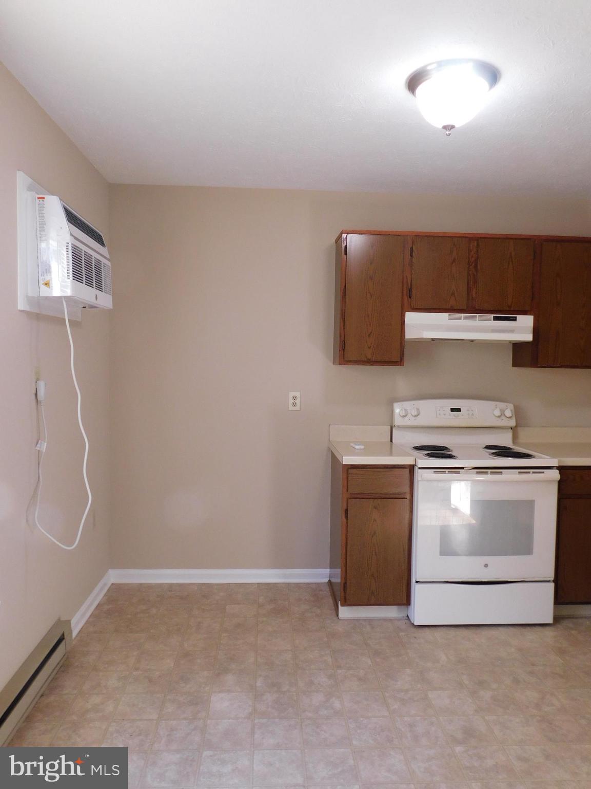 2918 Packer Street Winchester, VA 22601 - Photo 9 of 12 a kitchen with a stove and a refrigerator