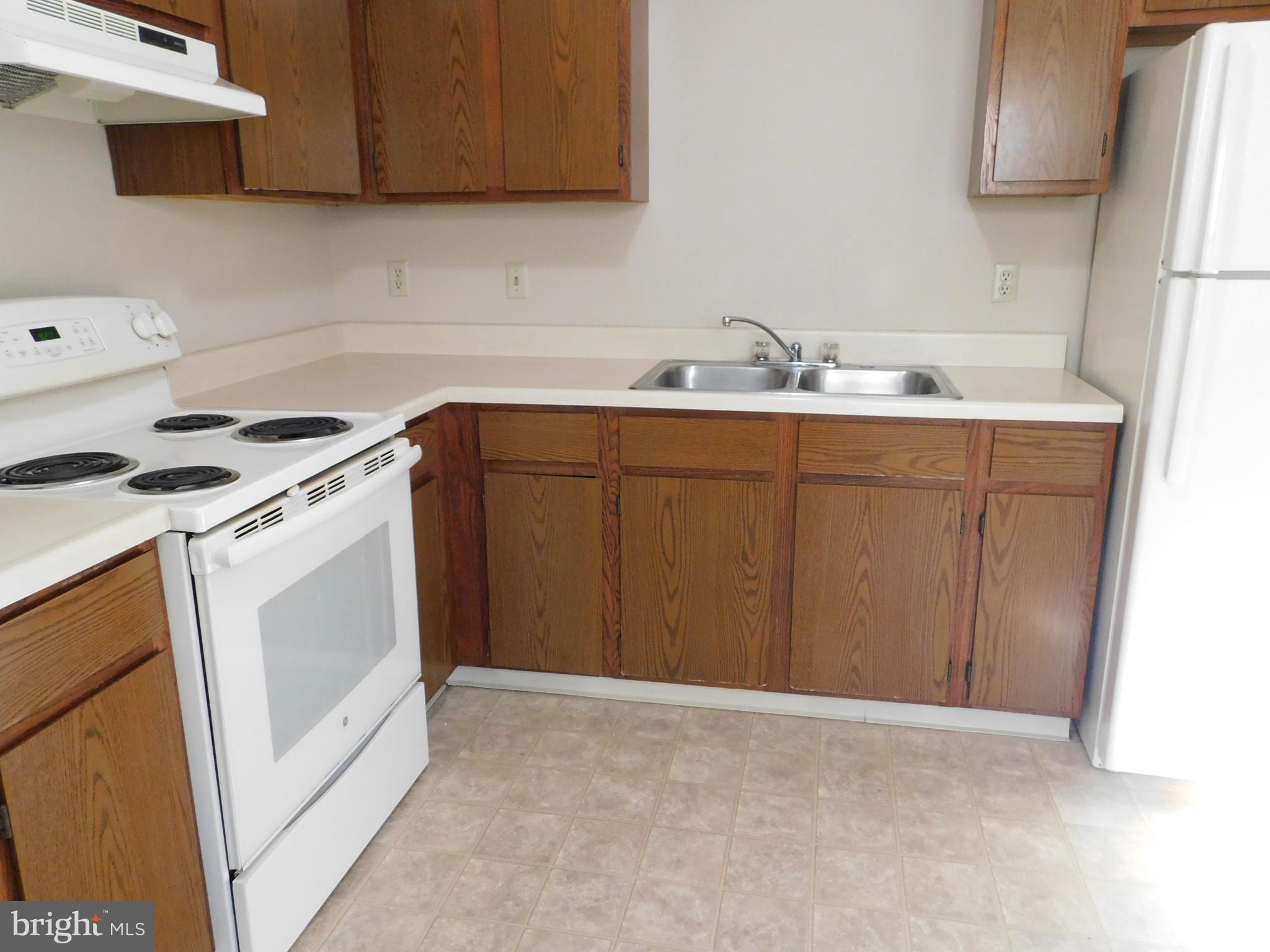 2918 Packer Street Winchester, VA 22601 - Photo 10 of 12 a kitchen with a sink stove and cabinets