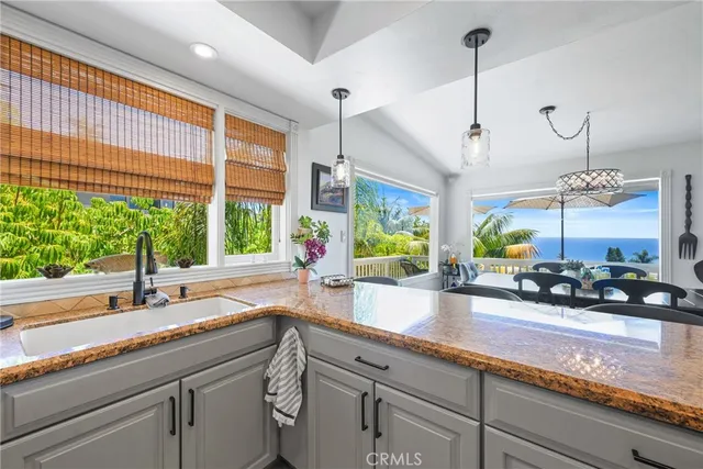 a view of a patio with couches table and chairs and potted plants