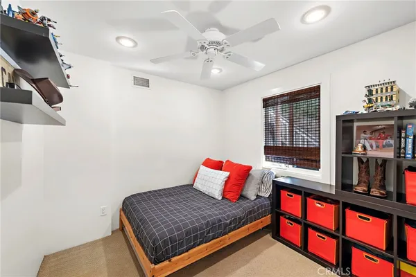 a view of a chairs and table in the backyard