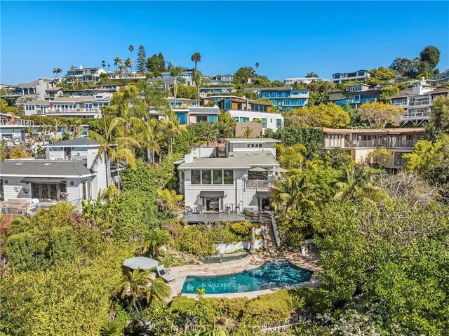 a view of a backyard with plants and a garden