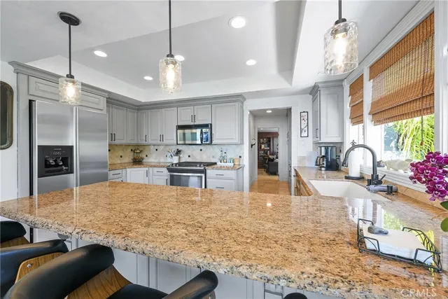 a view of a wooden fence and flowers around