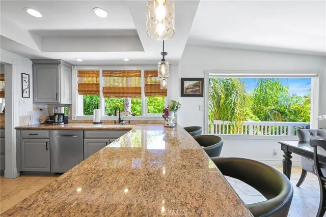 an aerial view of a building with ocean view