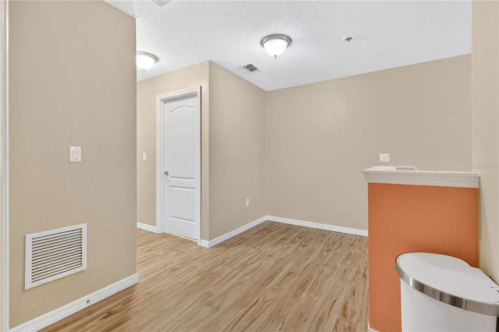 1938 Commander Way Kissimmee, FL 34746 - Photo 17 of 30 a view of a livingroom with wooden floor