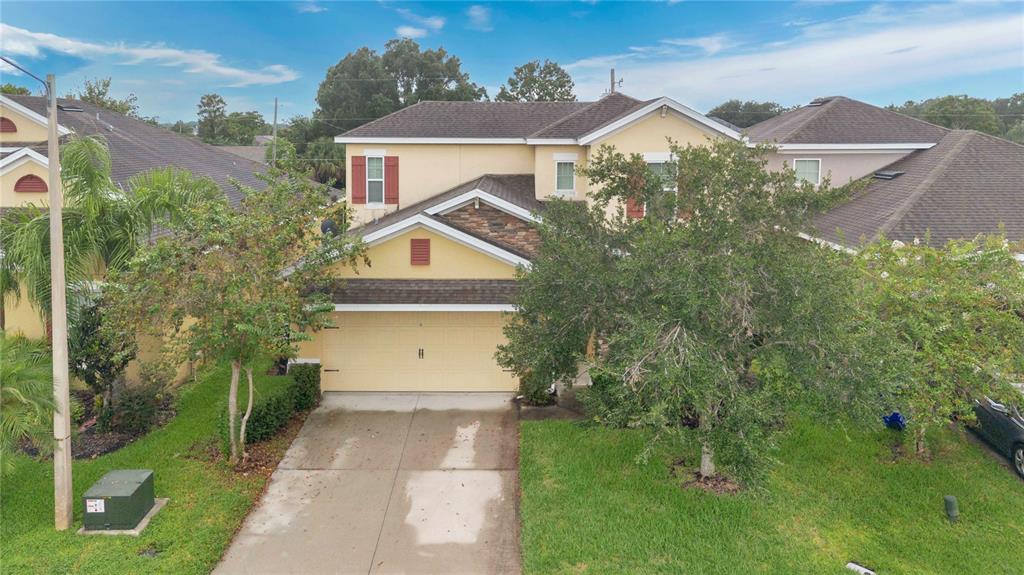 1938 Commander Way Kissimmee, FL 34746 - Photo 21 of 30 a front view of a house with a yard