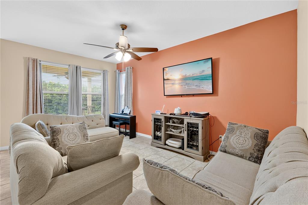 1938 Commander Way Kissimmee, FL 34746 - Photo 5 of 30 a living room with furniture and a large window