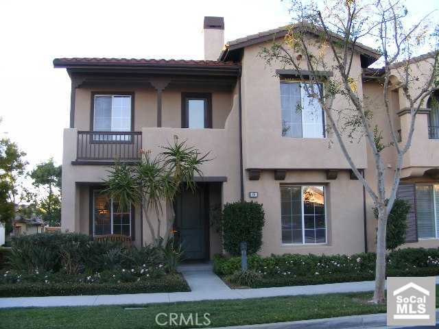 a house that has a palm tree in front of it