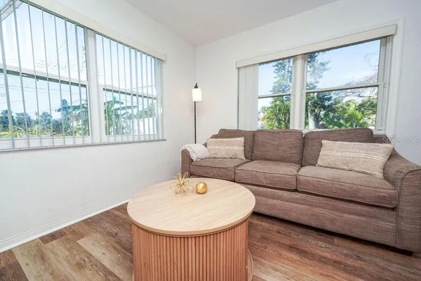a living room with furniture and a window
