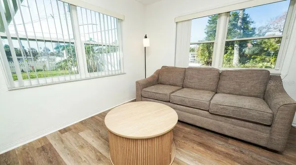 a living room with furniture and a large window