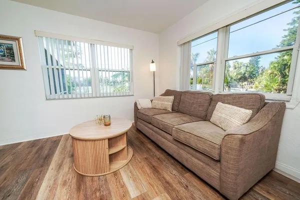a living room with furniture and a window