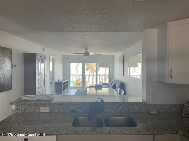 3901 Dixie Highway Northeast, Unit 210 Palm Bay, FL 32905 - Photo 3 of 9 a living room with furniture and large windows