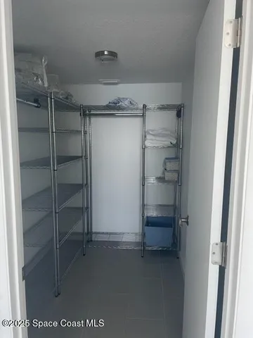 a view of an empty walk in closet