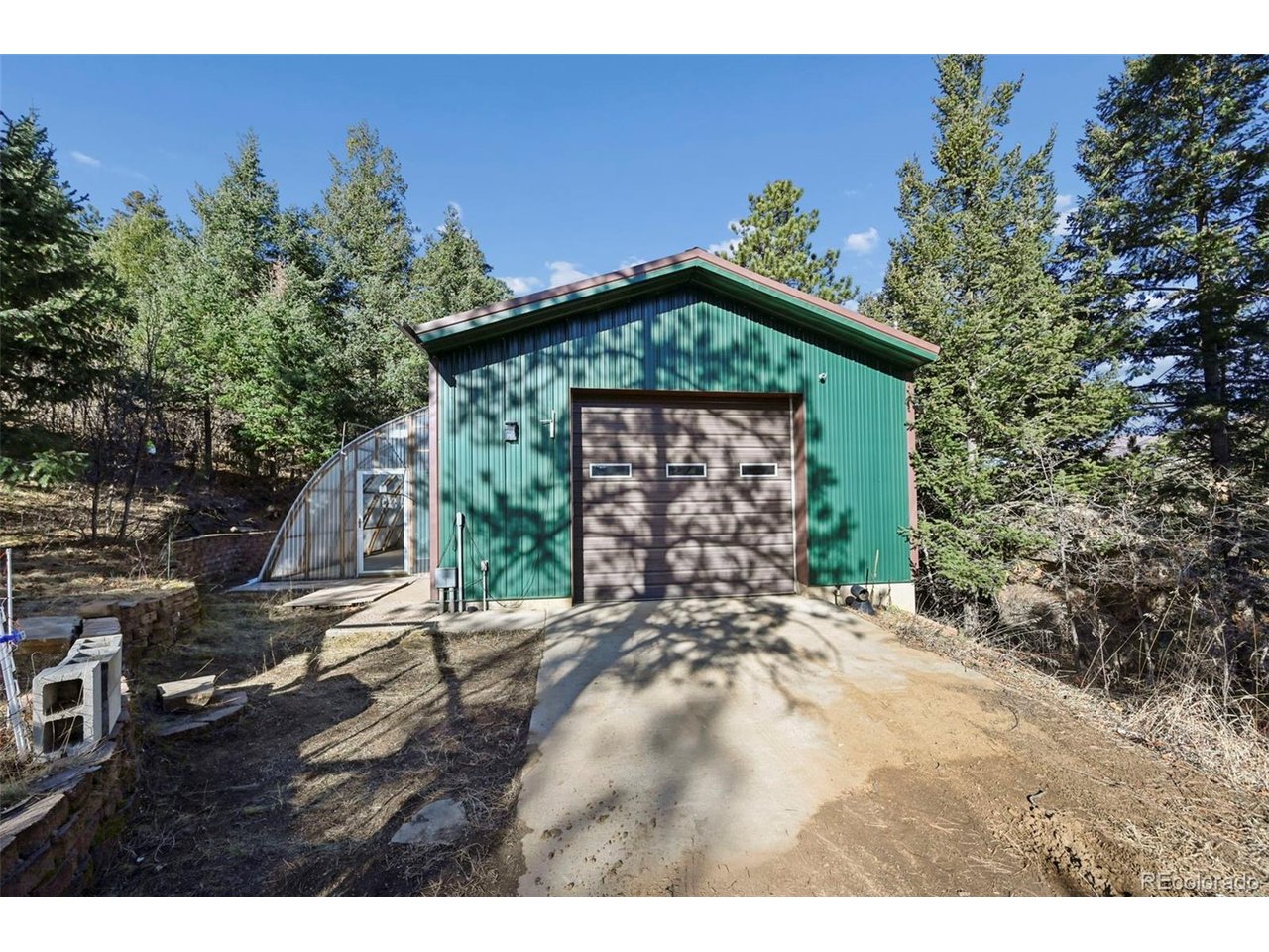 7415 West Highway 24 Cascade, CO 80809 - Photo 43 of 45 a front view of a house with a yard