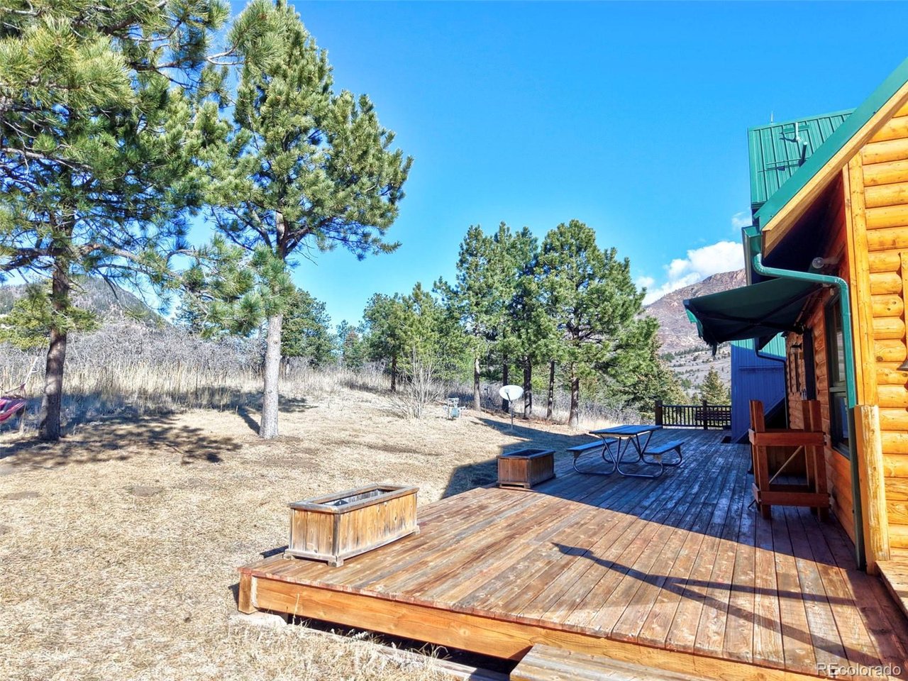7415 West Highway 24 Cascade, CO 80809 - Photo 8 of 45 a view of a backyard with sitting area