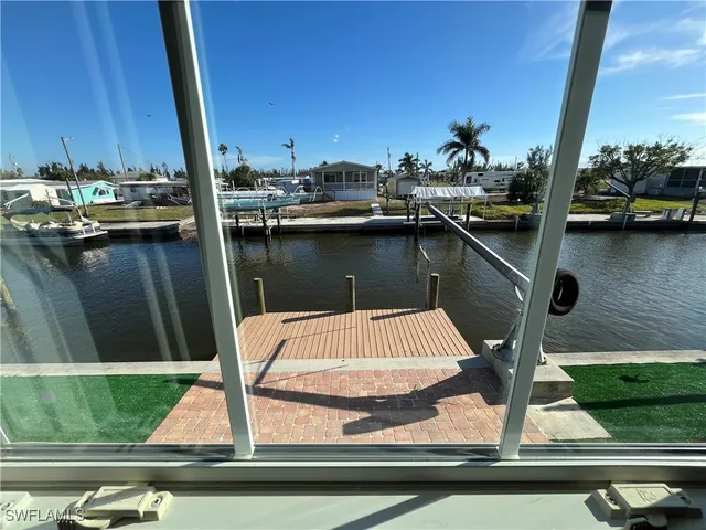 a view of swimming pool with a chairs