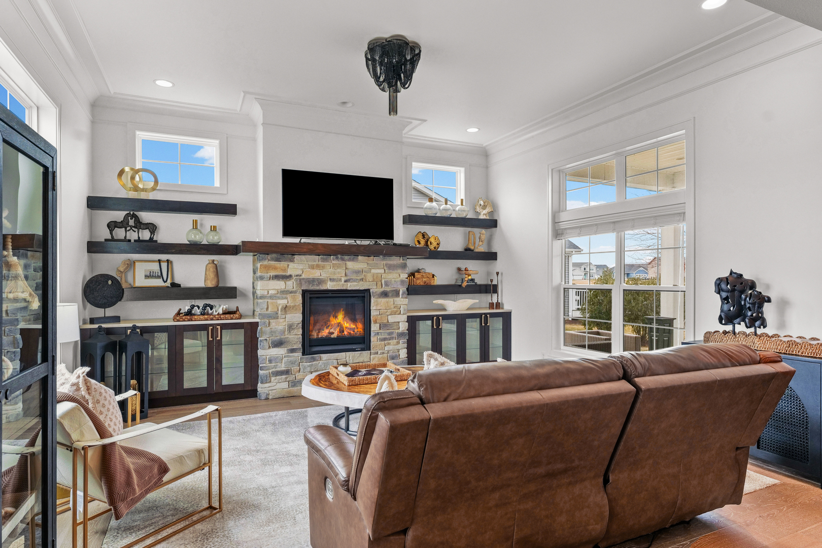 3901 Freedom Boulevard Champaign, IL 61822 - Photo 11 of 55 a living room with furniture a flat screen tv and a fireplace