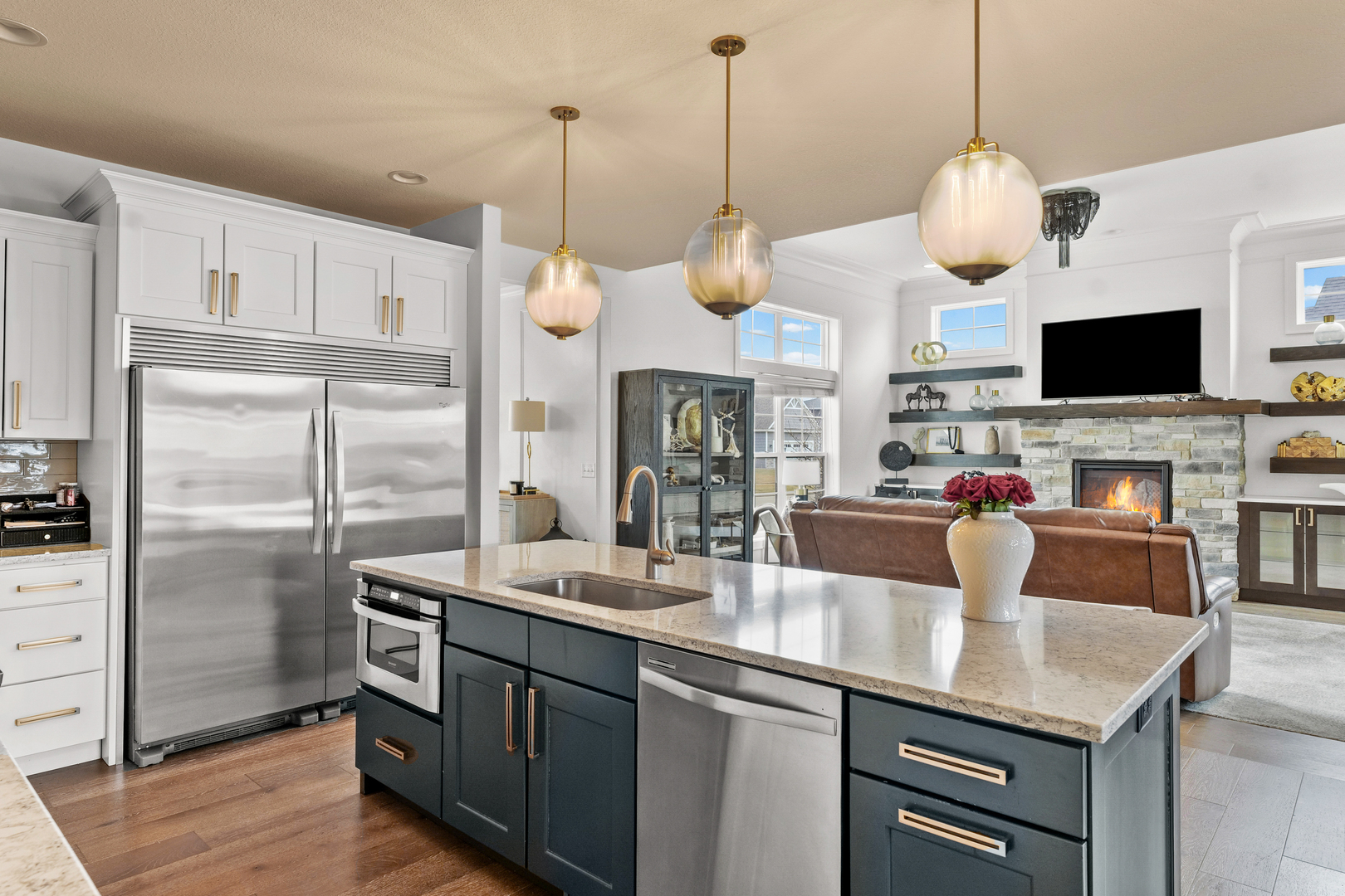 3901 Freedom Boulevard Champaign, IL 61822 - Photo 19 of 55 a kitchen with stainless steel appliances granite countertop a sink a stove and a wooden floor