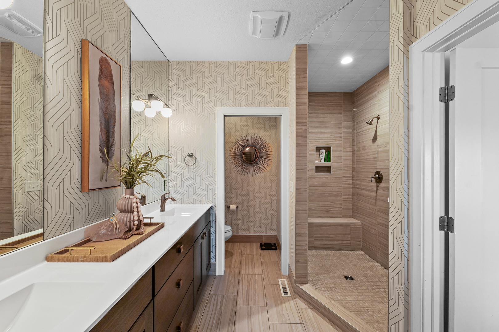 3901 Freedom Boulevard Champaign, IL 61822 - Photo 31 of 55 a bathroom with a granite countertop sink a mirror a shower and a bathtub