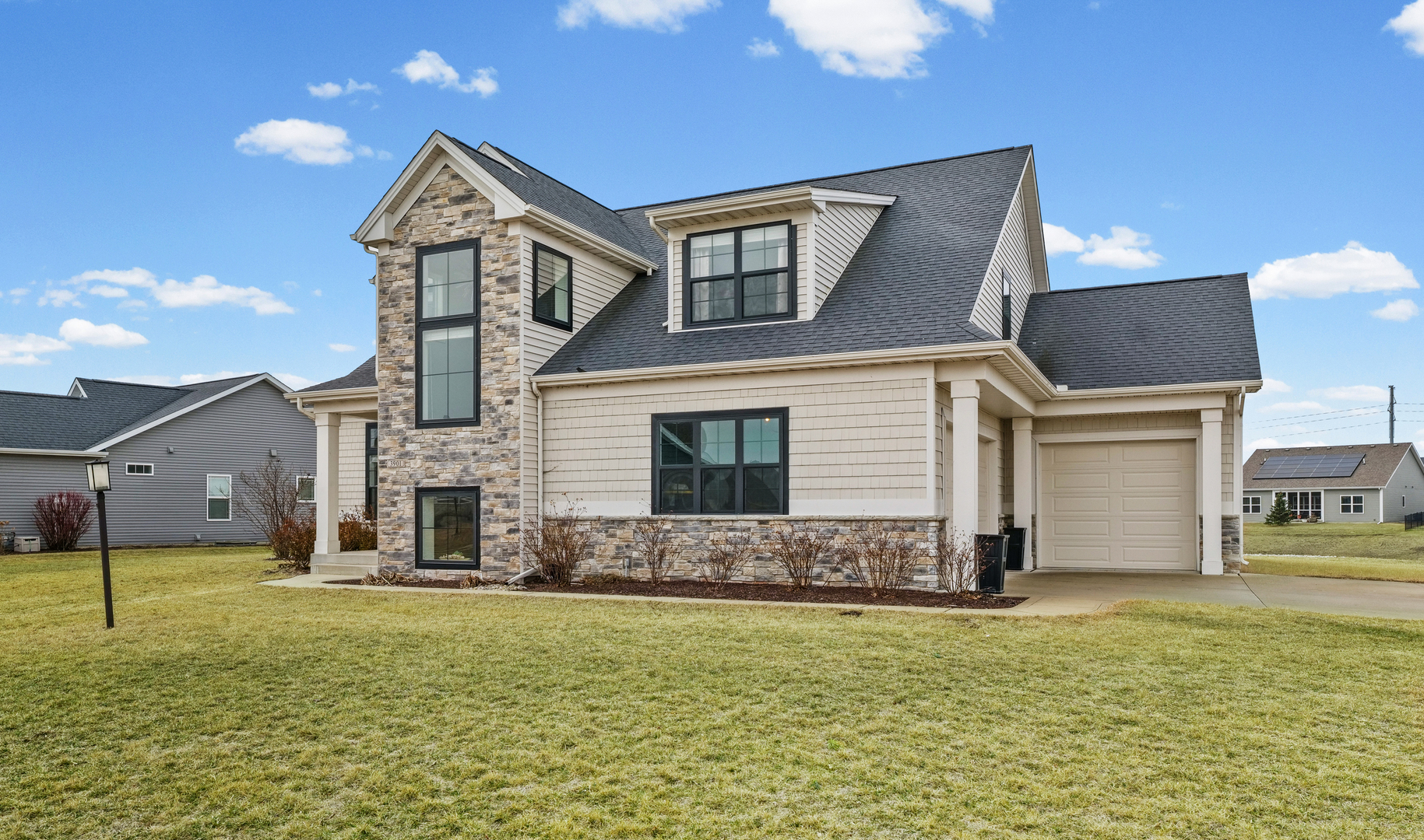 3901 Freedom Boulevard Champaign, IL 61822 - Photo 4 of 55 a front view of a house with a yard