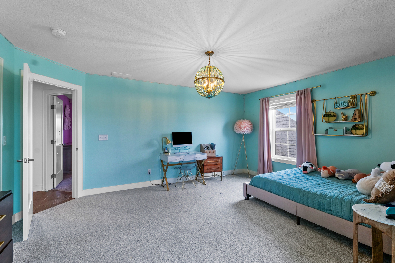 3901 Freedom Boulevard Champaign, IL 61822 - Photo 44 of 55 a bedroom with a bed and a chandelier