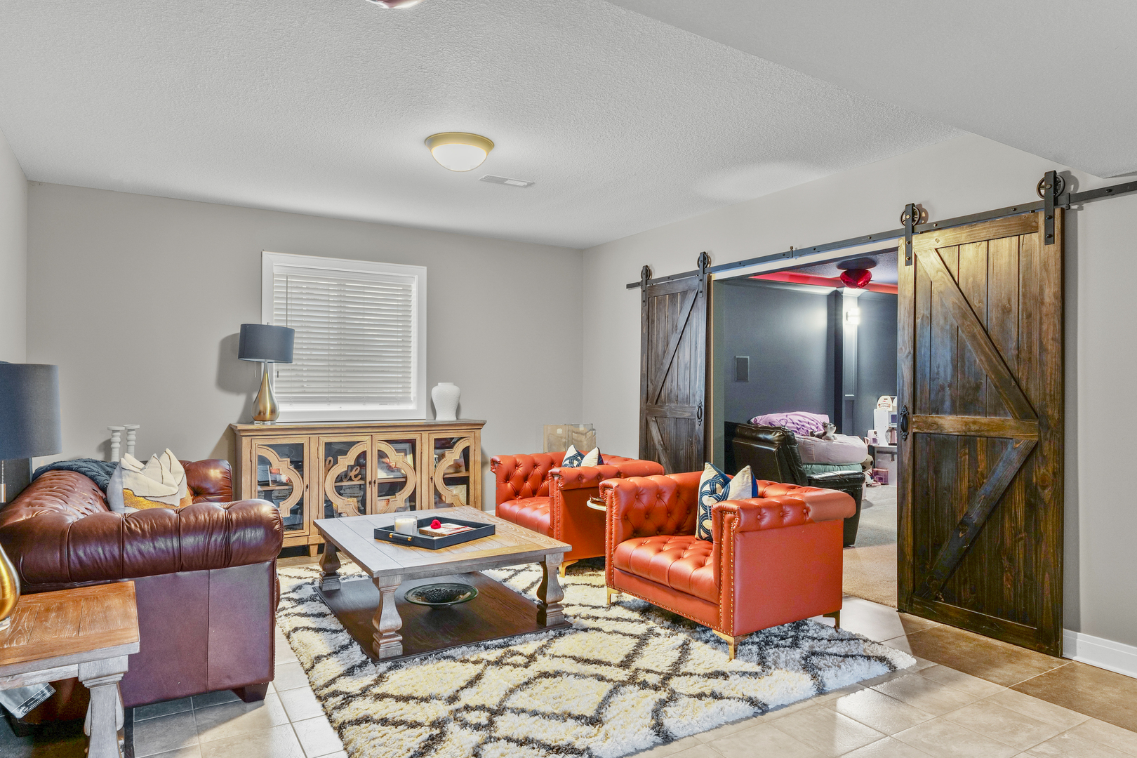 3901 Freedom Boulevard Champaign, IL 61822 - Photo 47 of 55 a living room with furniture a rug and a flat screen tv