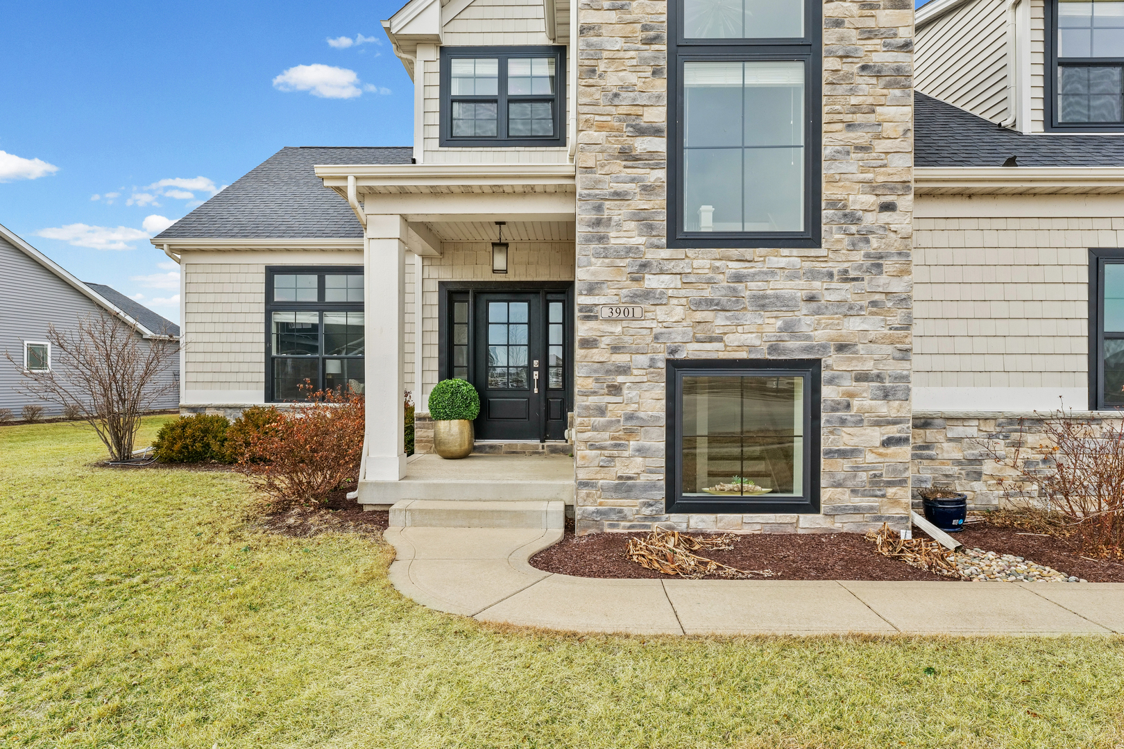 3901 Freedom Boulevard Champaign, IL 61822 - Photo 5 of 55 a front view of a house with garden