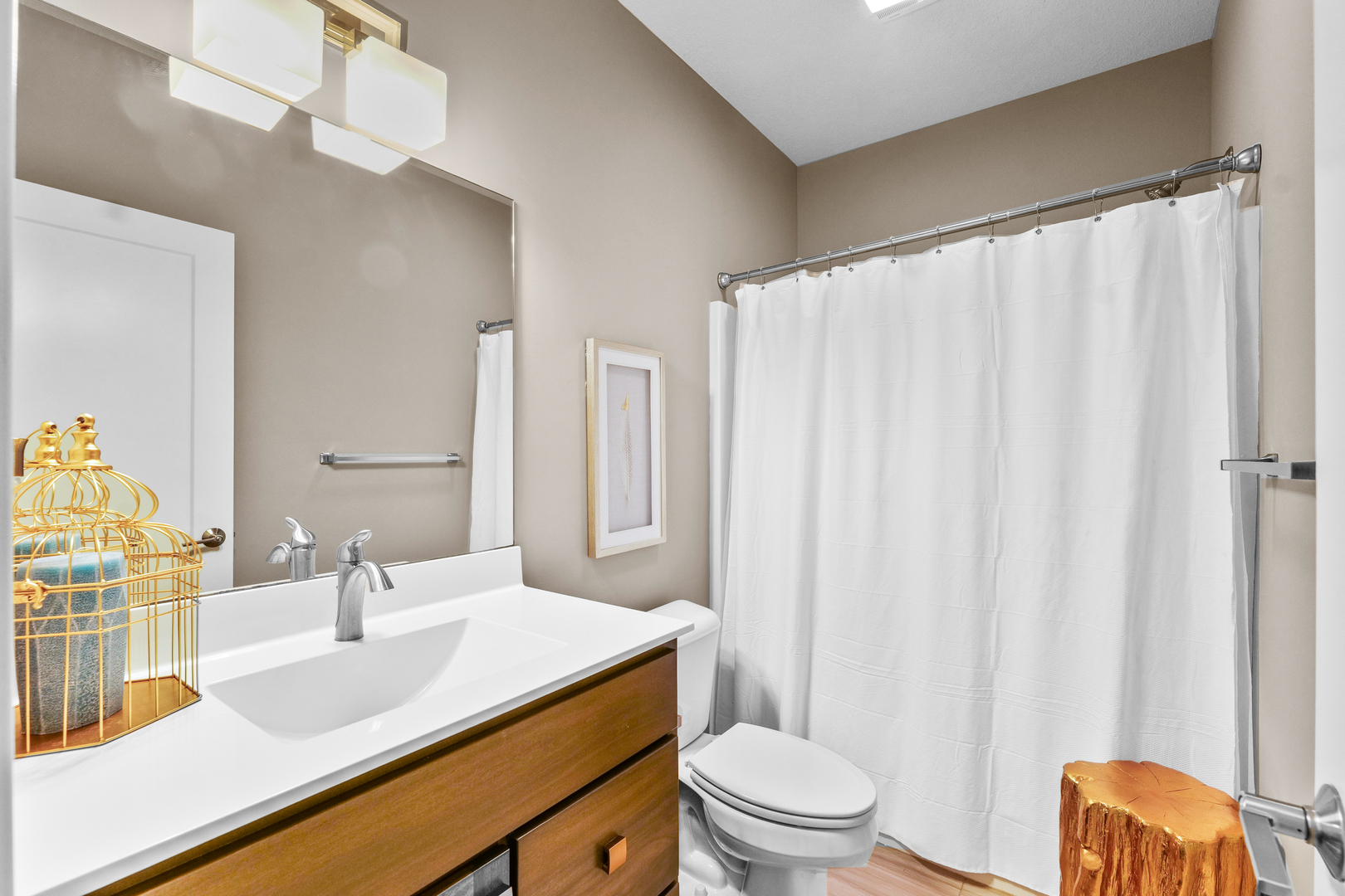 3901 Freedom Boulevard Champaign, IL 61822 - Photo 51 of 55 a bathroom with a sink a toilet a mirror and shower curtain