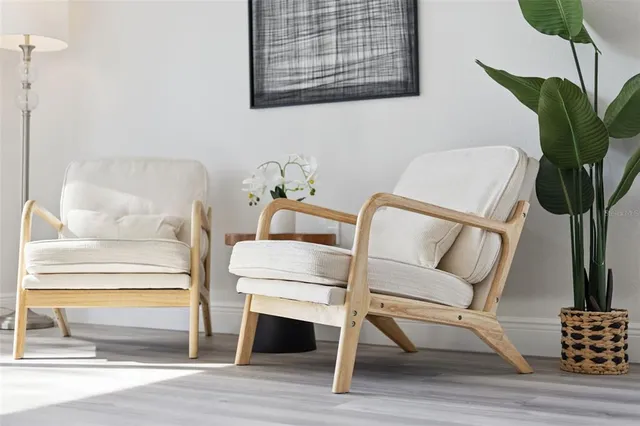 a living room with furniture and a potted plant