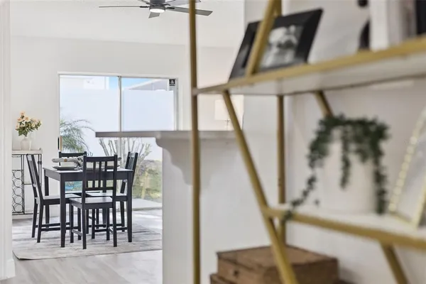 a view of a dining room with furniture and wooden floor
