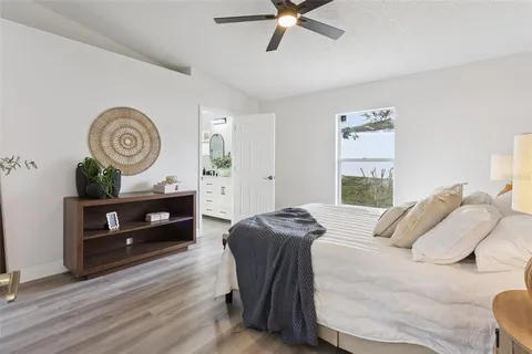 a bedroom with a bed and a dresser