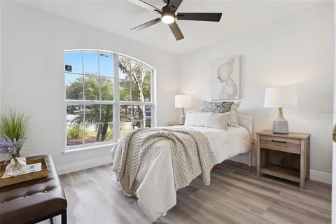 a bed room with a bed and a window