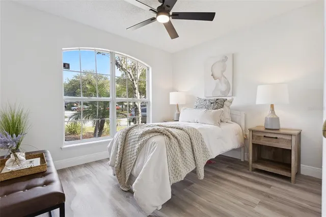 a bed room with a bed and a window