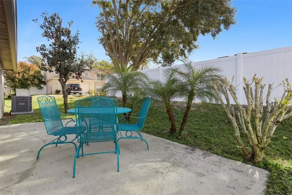a view of a chairs and table in the patio
