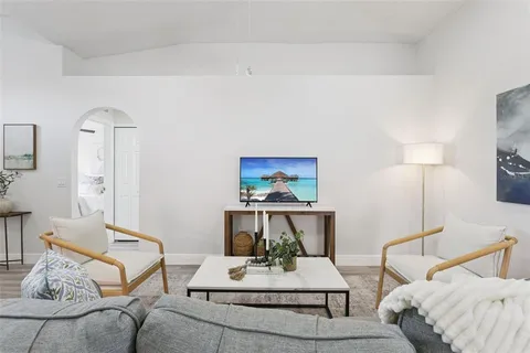 a living room with furniture and a table